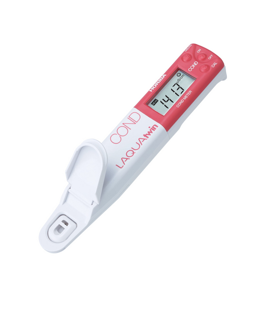 A digital conductivity meter with a red and white body and a digital display, labeled 'HORIBA'.